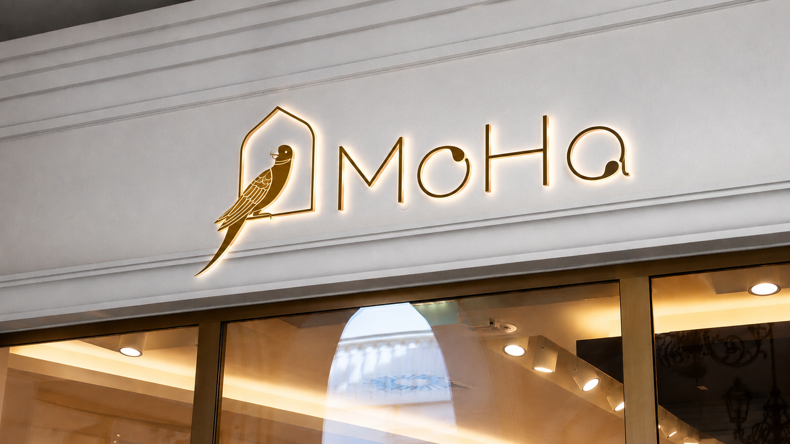 MoHa gold storefront signage on stone facade